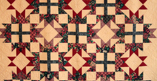 photo of green read and cream quilt
